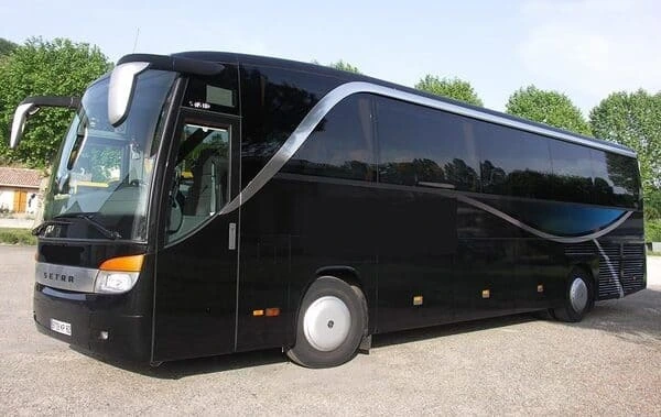 Sleek 44-seater luxury coach available for hire in France, featuring a black exterior