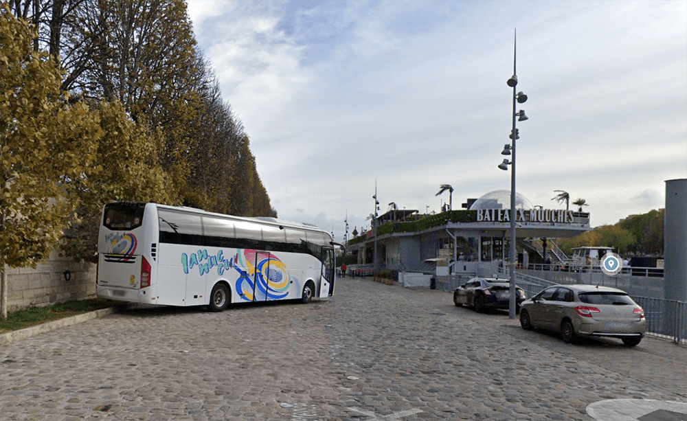 Executive coach parked at Port de la Conference near Bateaux-Mouches in Paris, available for group rentals