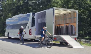 A coach with a trailer for 32 bikes in the Alps